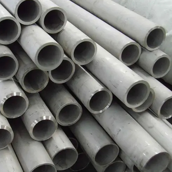 Which two materials are often used in stainless steel heat exchange tubes?